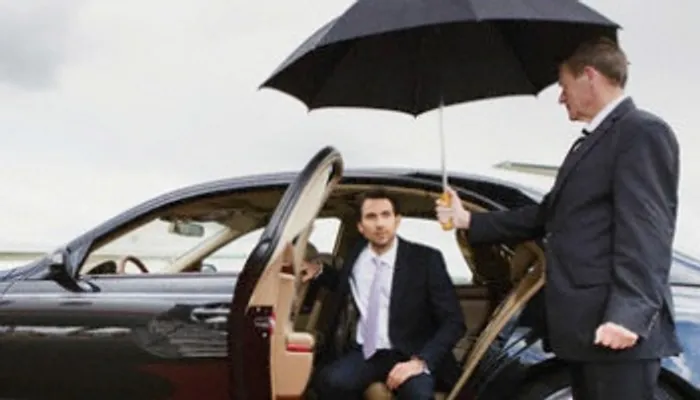 A passenger getting into an Aviemore taxi